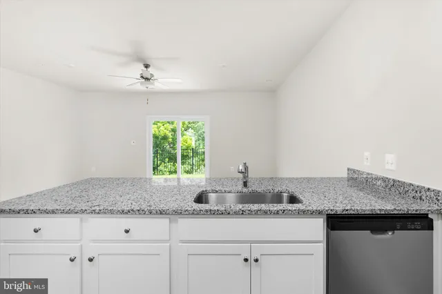 a kitchen with stainless steel appliances granite countertop a stove microwave and refrigerator