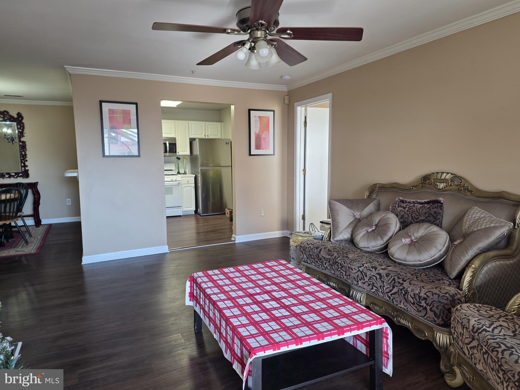 1037 Gardenview Loop, Unit 302 Woodbridge, VA 22191 - Photo 2 of 14 a bedroom with a bed dresser and wooden floor