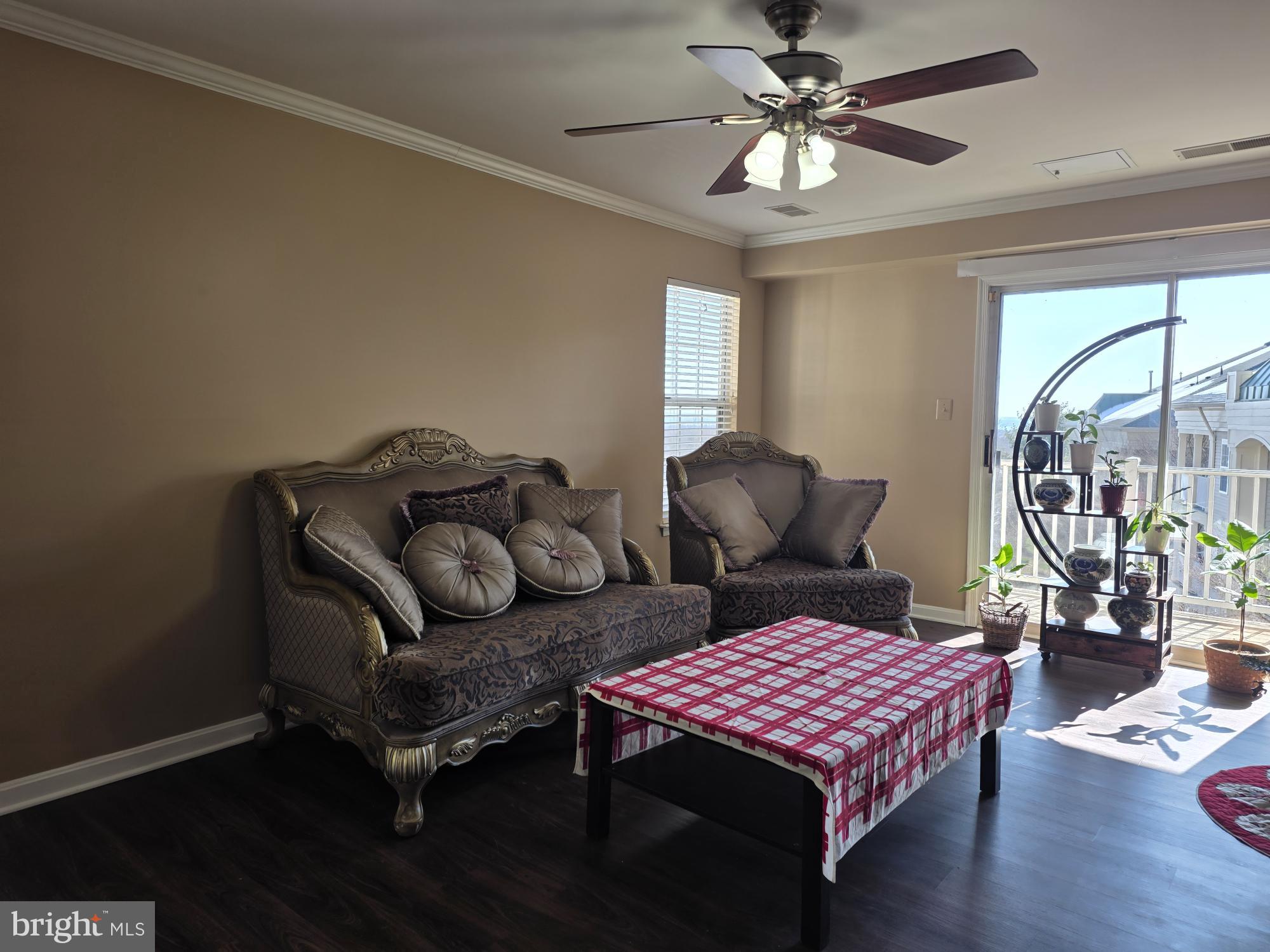 1037 Gardenview Loop, Unit 302 Woodbridge, VA 22191 - Photo 4 of 14 a bedroom with furniture and wooden floor