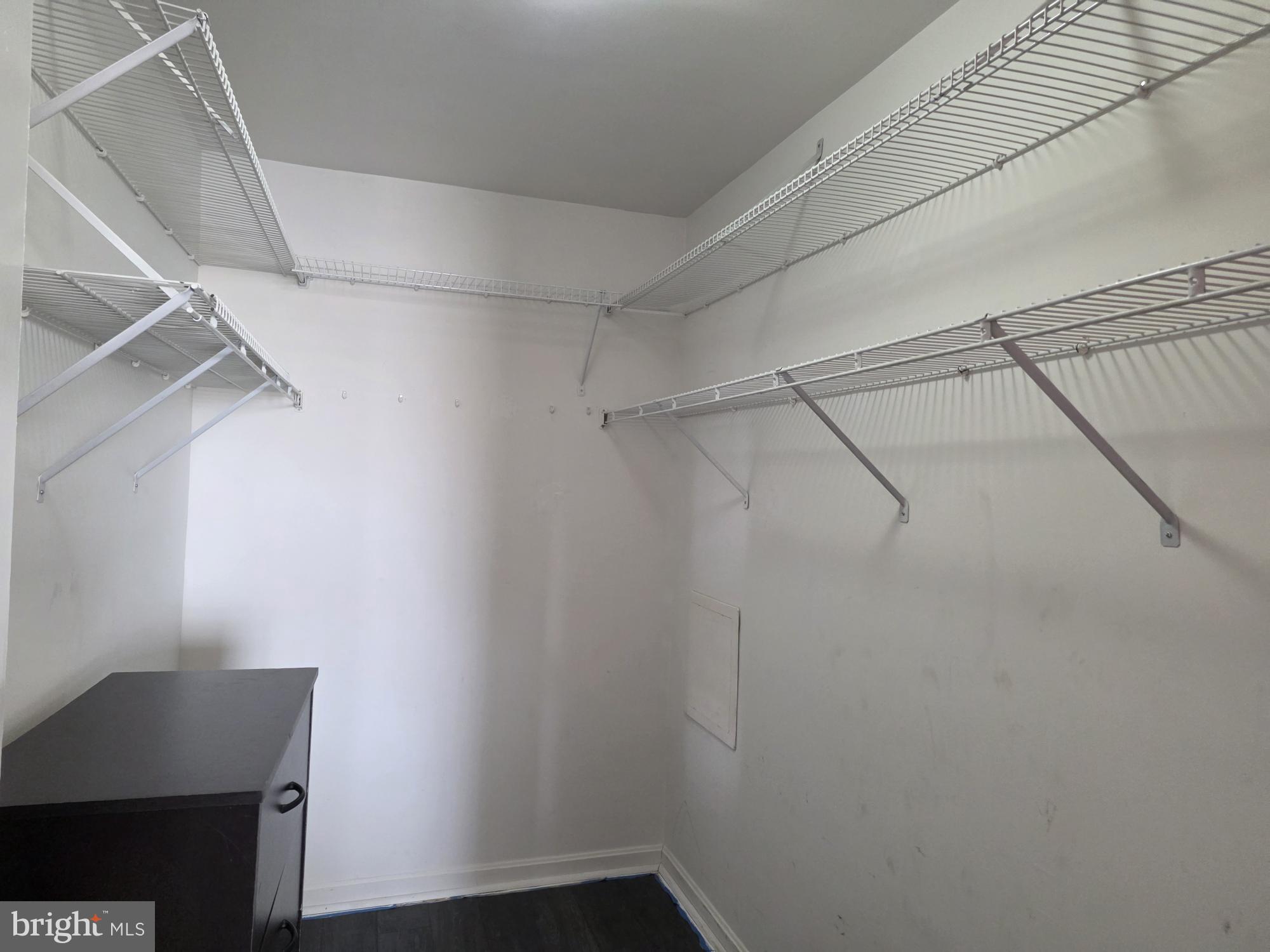 1037 Gardenview Loop, Unit 302 Woodbridge, VA 22191 - Photo 8 of 14 a view of a room with racks on the wall