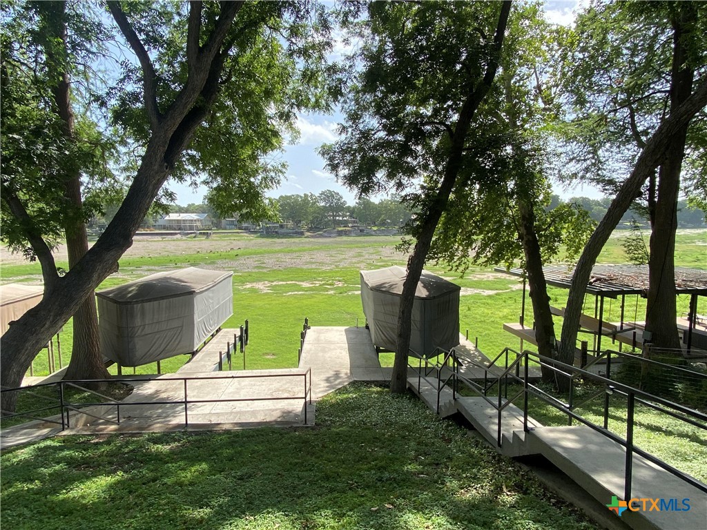906 Lakeview Trail McQueeney, TX 78123 - Photo 12 of 13 a view of a garden with lake