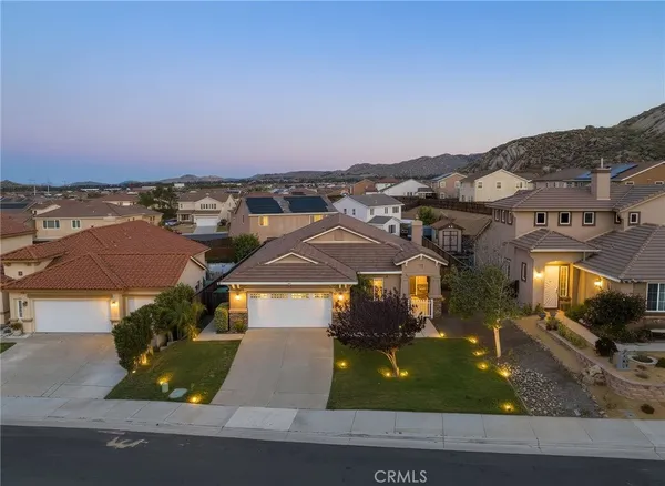 an aerial view of a house with a garden