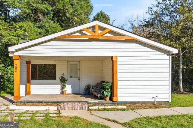 a front view of a house with garden