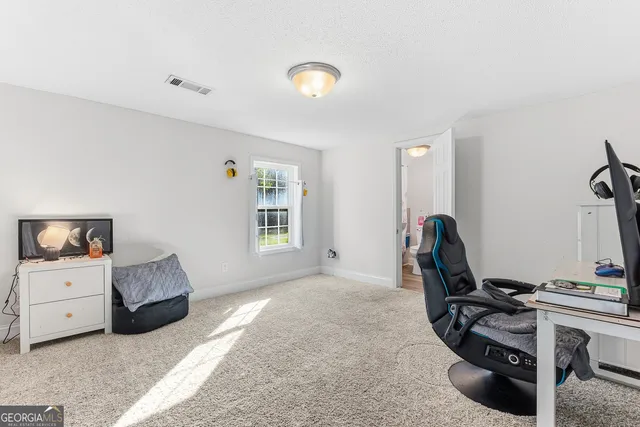 a workspace with furniture and window