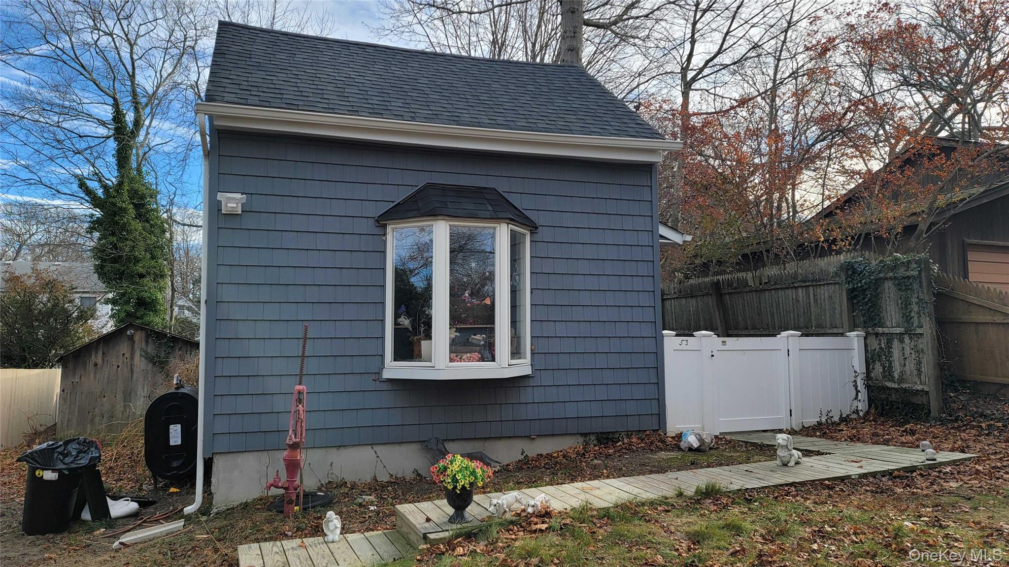 View of outbuilding with oil tank