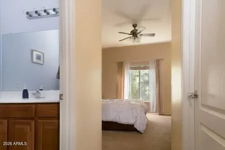 a en suite bathroom with a sink and a mirror
