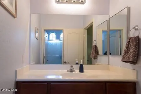 a bathroom with a sink and a mirror