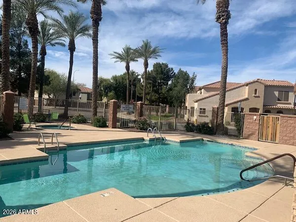 a view of a swimming pool with a patio