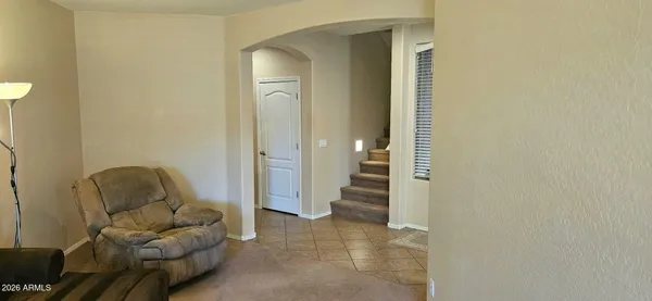 a living room with furniture and a gate