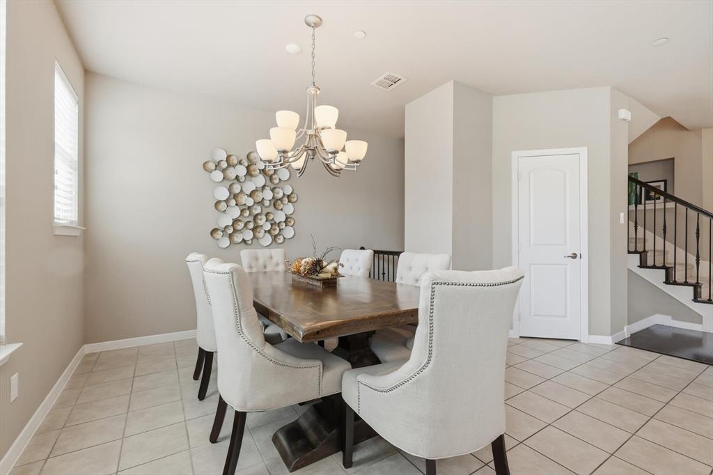 3941 Asbury Lane Addison, TX 75001 - Photo 14 of 30 a view of a dining room with furniture and chandelier