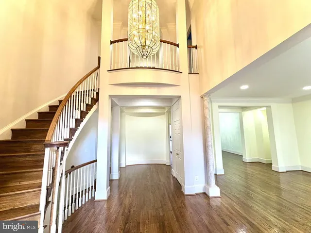 a view of an entryway with wooden floor