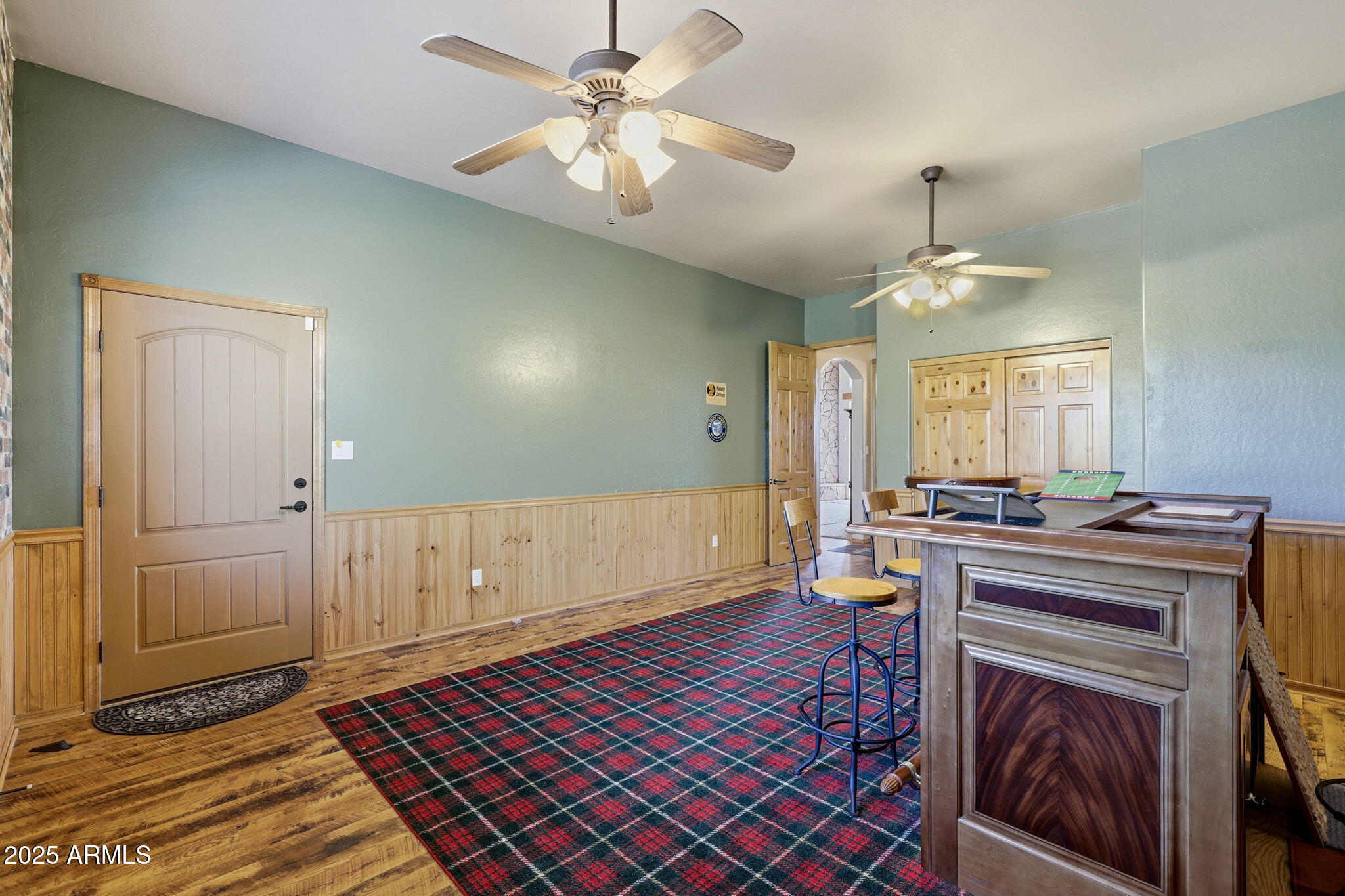 2276 Thunderbird Way Overgaard, AZ 85933 - Photo 19 of 41 a view of a kitchen with a stove cabinets and wooden floor
