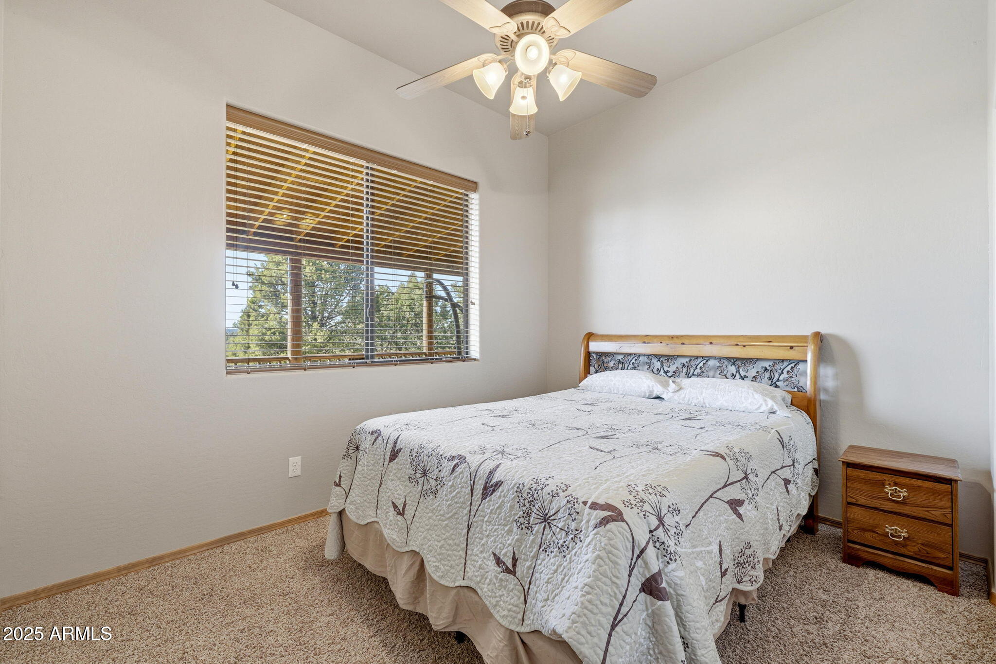 2276 Thunderbird Way Overgaard, AZ 85933 - Photo 23 of 41 a bedroom with a bed and a tv
