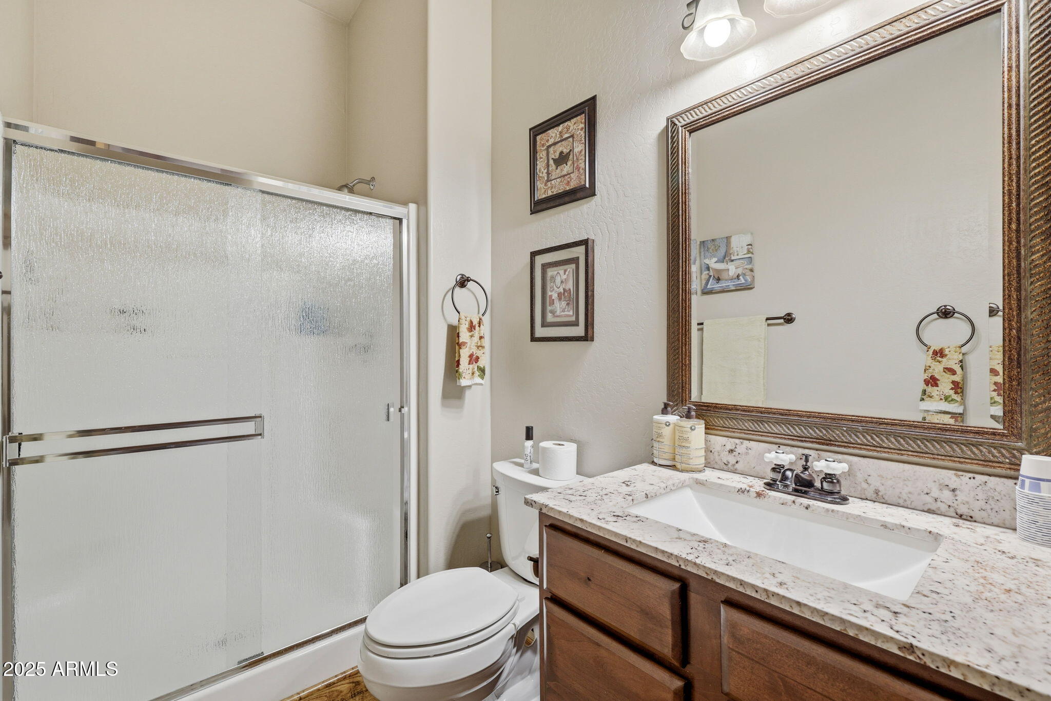2276 Thunderbird Way Overgaard, AZ 85933 - Photo 25 of 41 a bathroom with a granite countertop sink toilet and shower