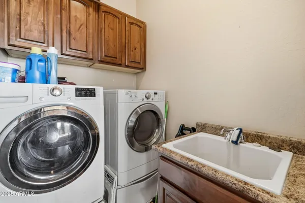 a utility room with dryer and washer
