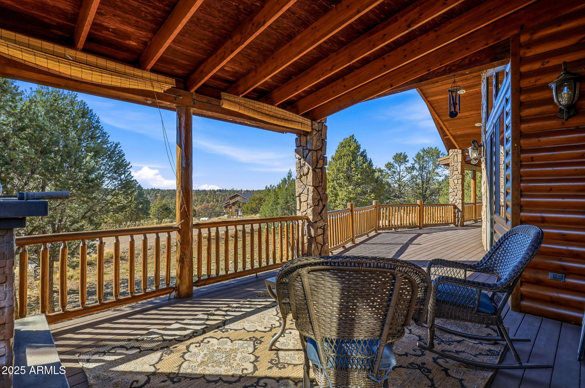 2276 Thunderbird Way Overgaard, AZ 85933 - Photo 28 of 41 a view of a patio with a table chairs and a yard