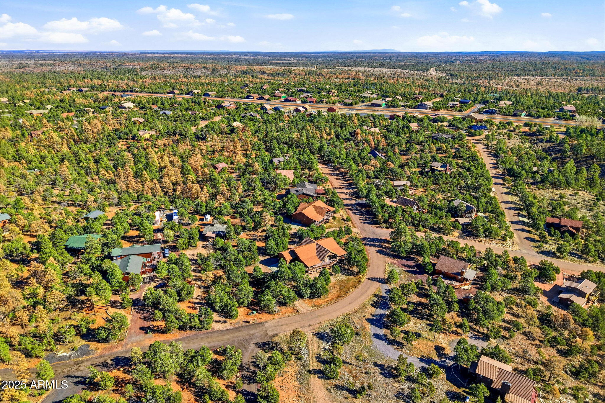 2276 Thunderbird Way Overgaard, AZ 85933 - Photo 32 of 41 an aerial view of residential building and ocean