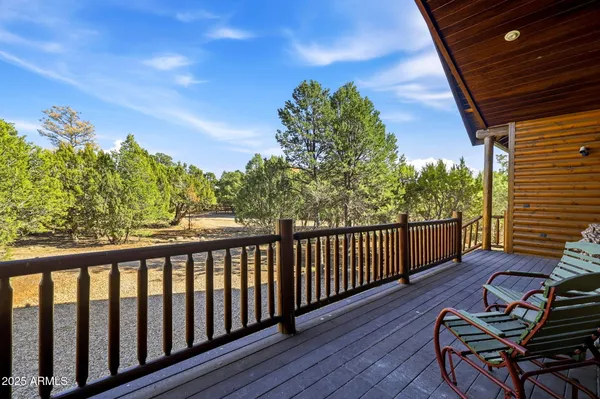 a view of a chairs and table in patio