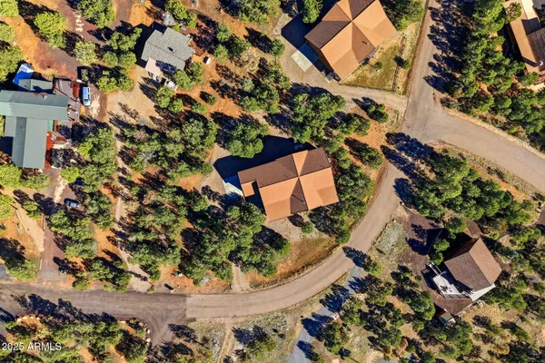view of a house with a yard and sitting area
