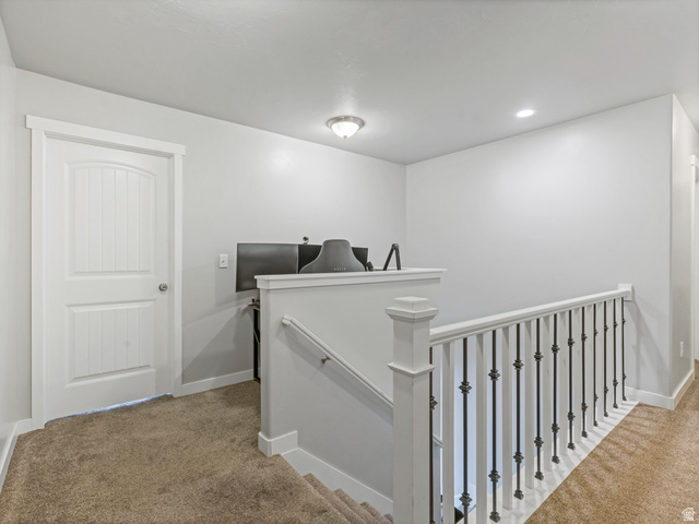 12214 Sunpark Lane Draper, UT 84020 - Photo 13 of 24 Hallway featuring light carpet, an upstairs landing, and recessed lighting