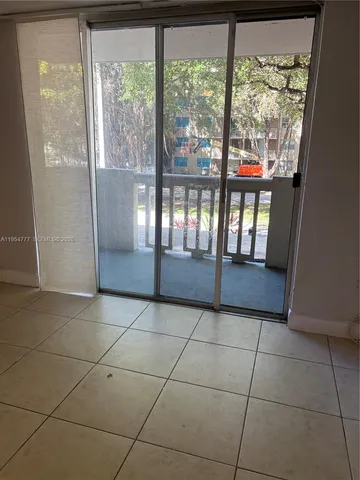 a view of a livingroom with a floor to ceiling window