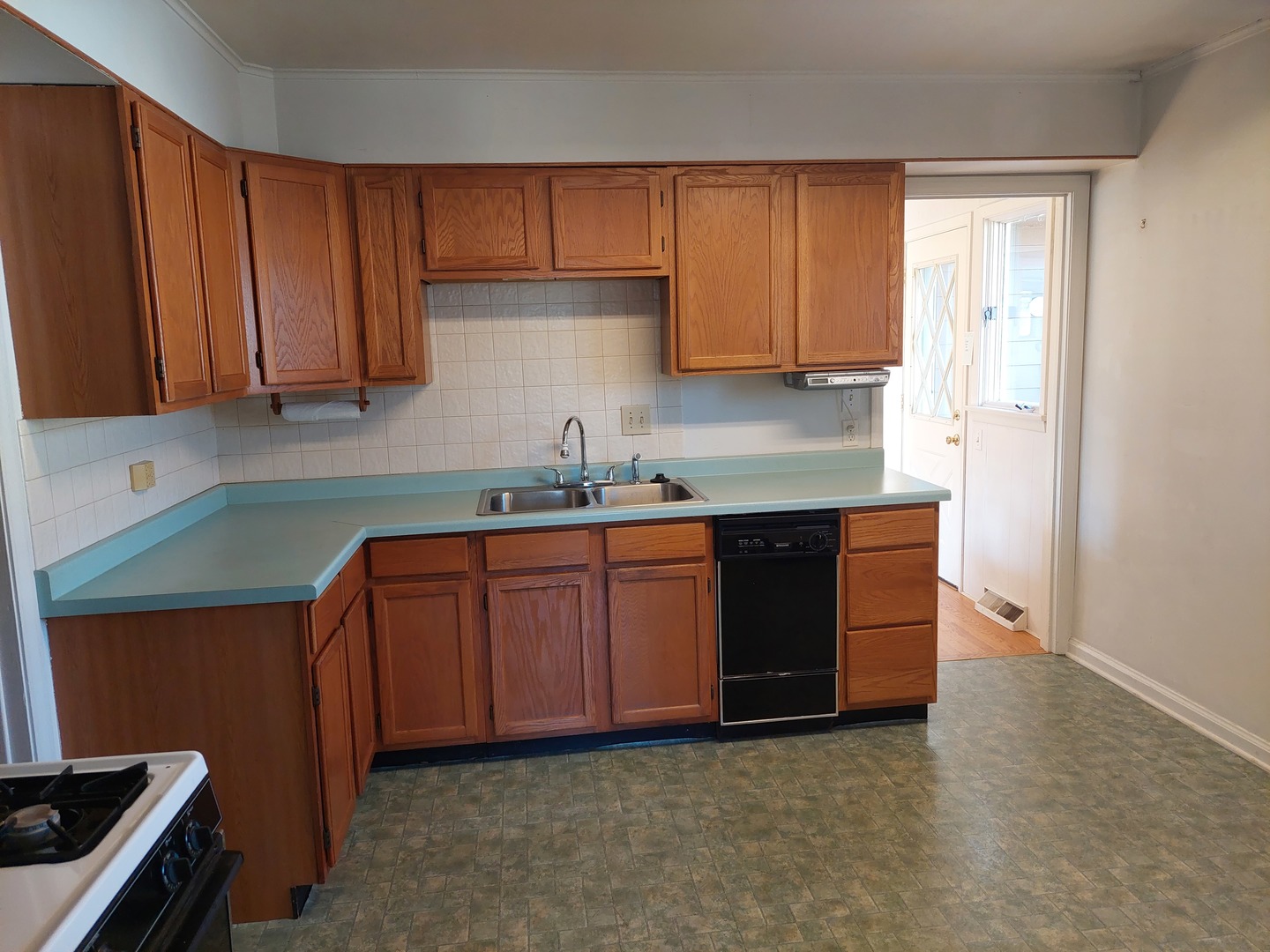 16 Aldine Road Lake Zurich, IL 60047 - Photo 8 of 24 a kitchen with granite countertop wooden cabinets a sink and a stove