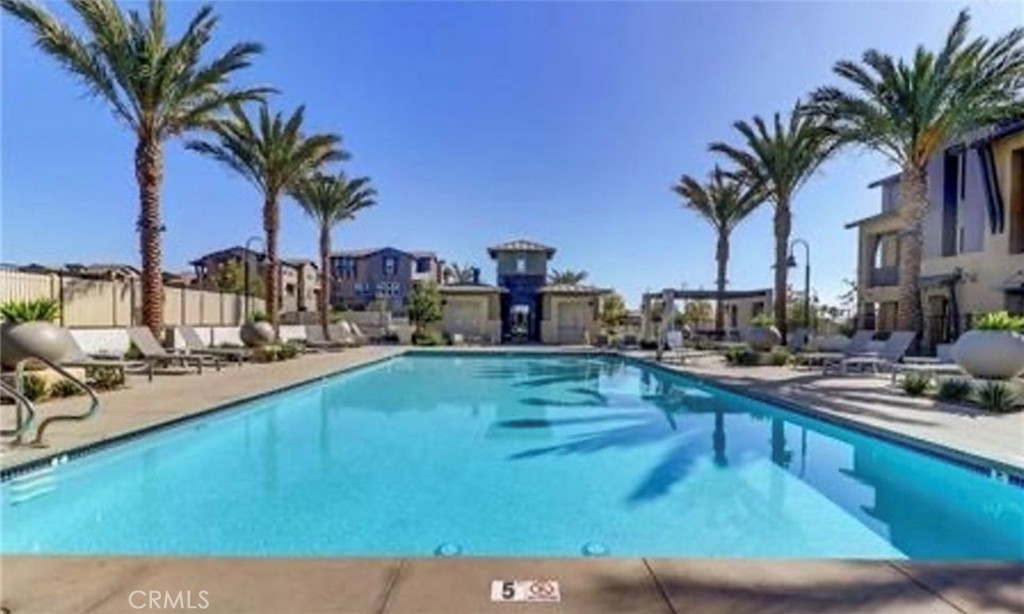 7400 Solstice Place Rancho Cucamonga, CA 91739 - Photo 20 of 22 a view of a swimming pool and lounge chair