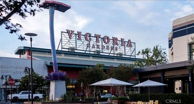 a front view of a house with yard and sitting area