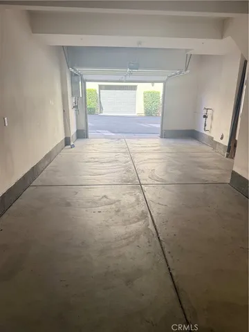 a view of an empty room and a window