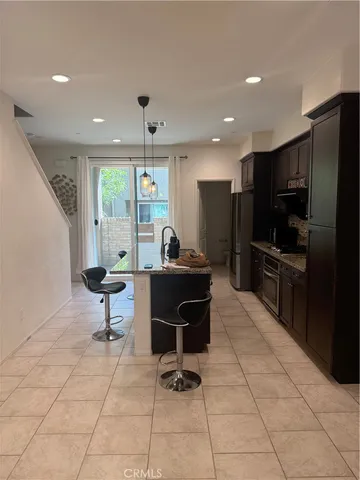 a living room with furniture a flat screen tv and outdoor view