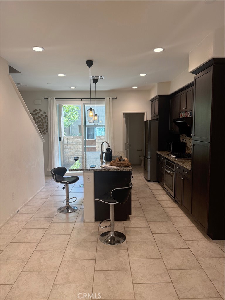 7400 Solstice Place Rancho Cucamonga, CA 91739 - Photo 4 of 22 a living room with furniture a flat screen tv and outdoor view