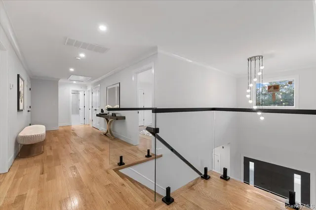 a view of an empty room with kitchen appliances and a window
