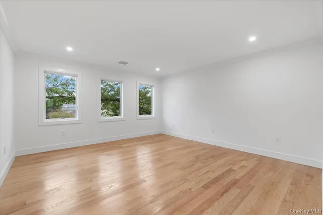 a spacious bedroom with a large bed and a couch