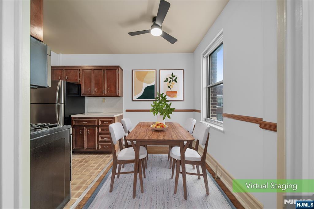100 East Palisade Avenue, Unit B51 Englewood, NJ 07631 - Photo 11 of 37 a view of a dining room with furniture and window