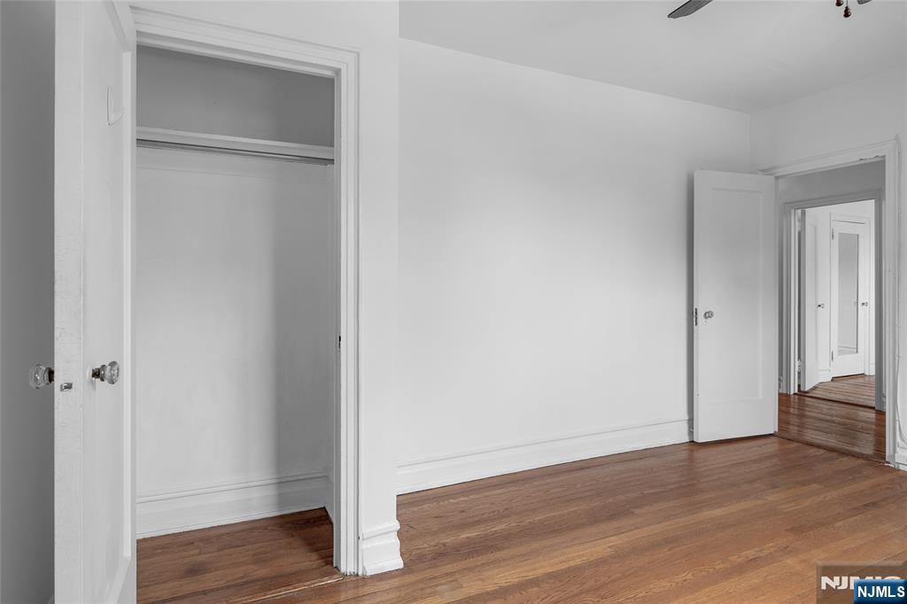 100 East Palisade Avenue, Unit B51 Englewood, NJ 07631 - Photo 23 of 37 a view of an empty room with wooden floor