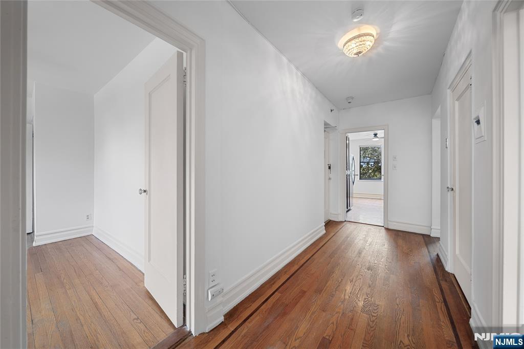 100 East Palisade Avenue, Unit B51 Englewood, NJ 07631 - Photo 24 of 37 a view of a hallway with wooden floor
