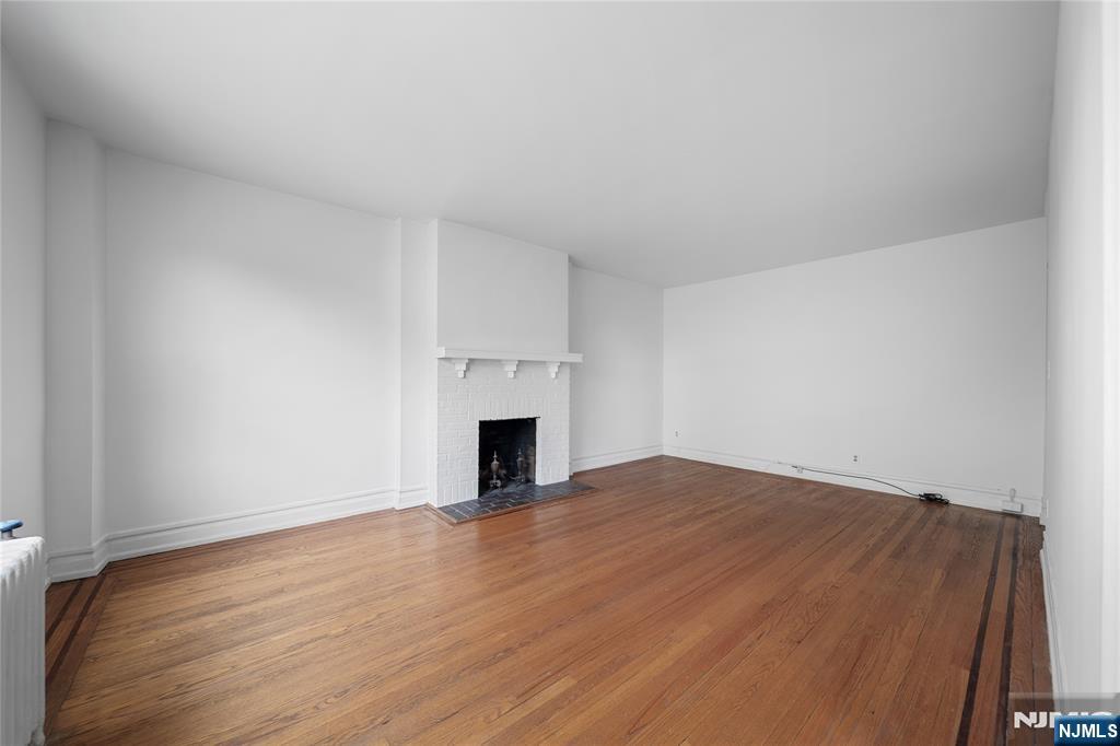 100 East Palisade Avenue, Unit B51 Englewood, NJ 07631 - Photo 7 of 37 a view of empty room with wooden floor
