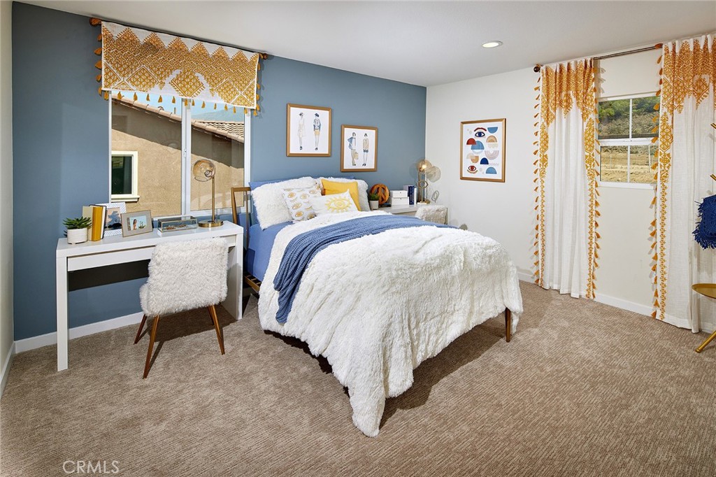 30952 Campania Road Highland, CA 92346 - Photo 15 of 27 a bed room with a bed and a chair