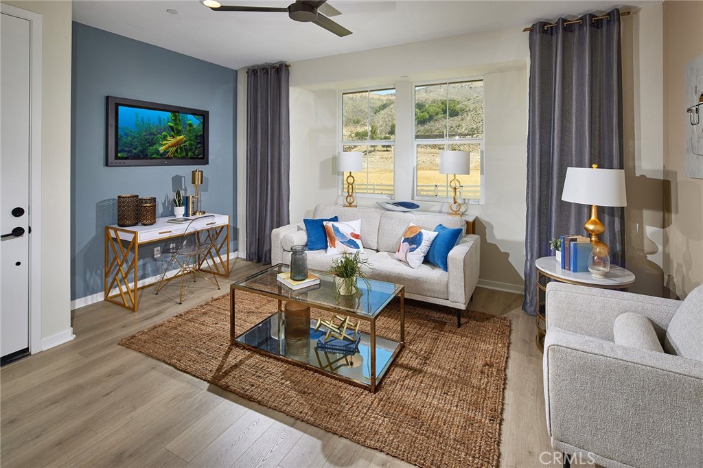 30952 Campania Road Highland, CA 92346 - Photo 18 of 27 a living room with furniture a flat screen tv and a large window