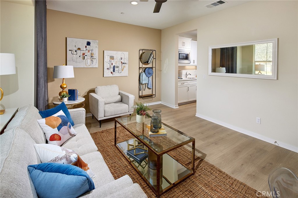 30952 Campania Road Highland, CA 92346 - Photo 19 of 27 a living room with furniture and a wooden floor