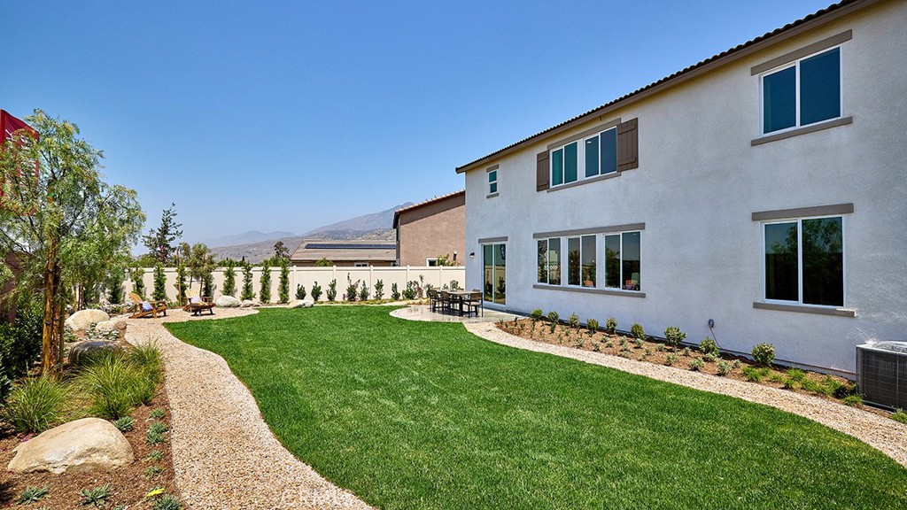 30952 Campania Road Highland, CA 92346 - Photo 25 of 27 a front view of a house with a garden