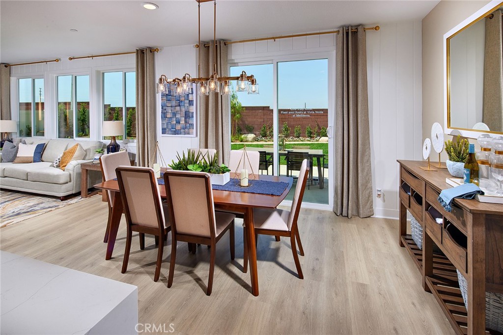 30952 Campania Road Highland, CA 92346 - Photo 5 of 27 a view of a dining room with furniture window and wooden floor