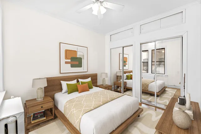 a bedroom with bed and window