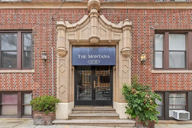 a view of a brick building with entryway