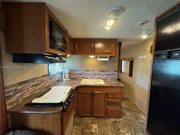 a kitchen with a stove and a microwave