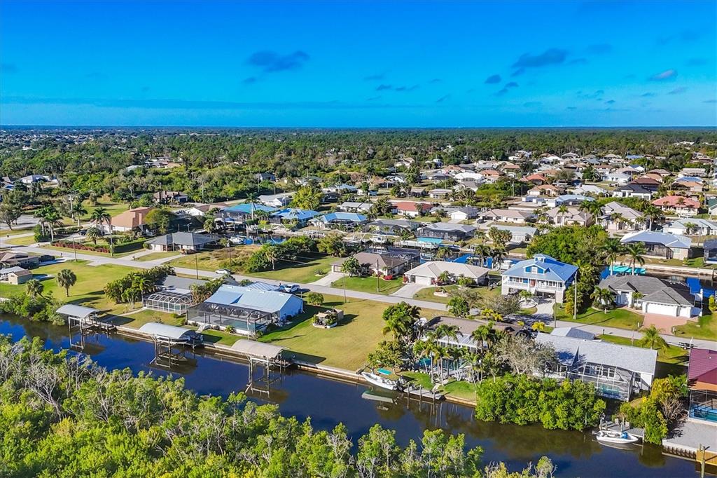 5276 Early Terrace Port Charlotte, FL 33981 - Photo 17 of 20 an aerial view of residential building and lake