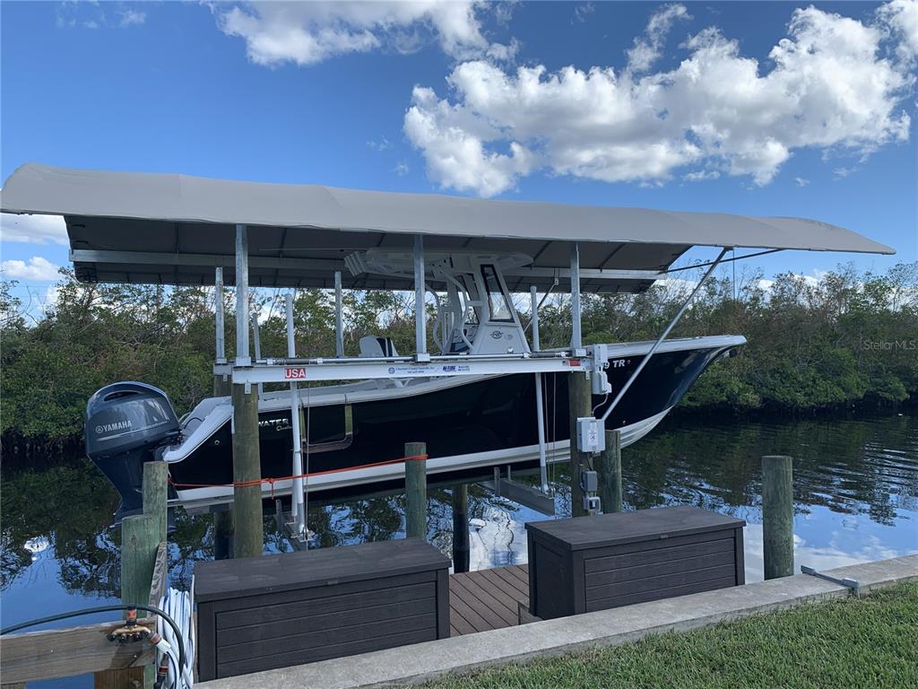 5276 Early Terrace Port Charlotte, FL 33981 - Photo 5 of 20 a front view of a house with swimming pool and garden