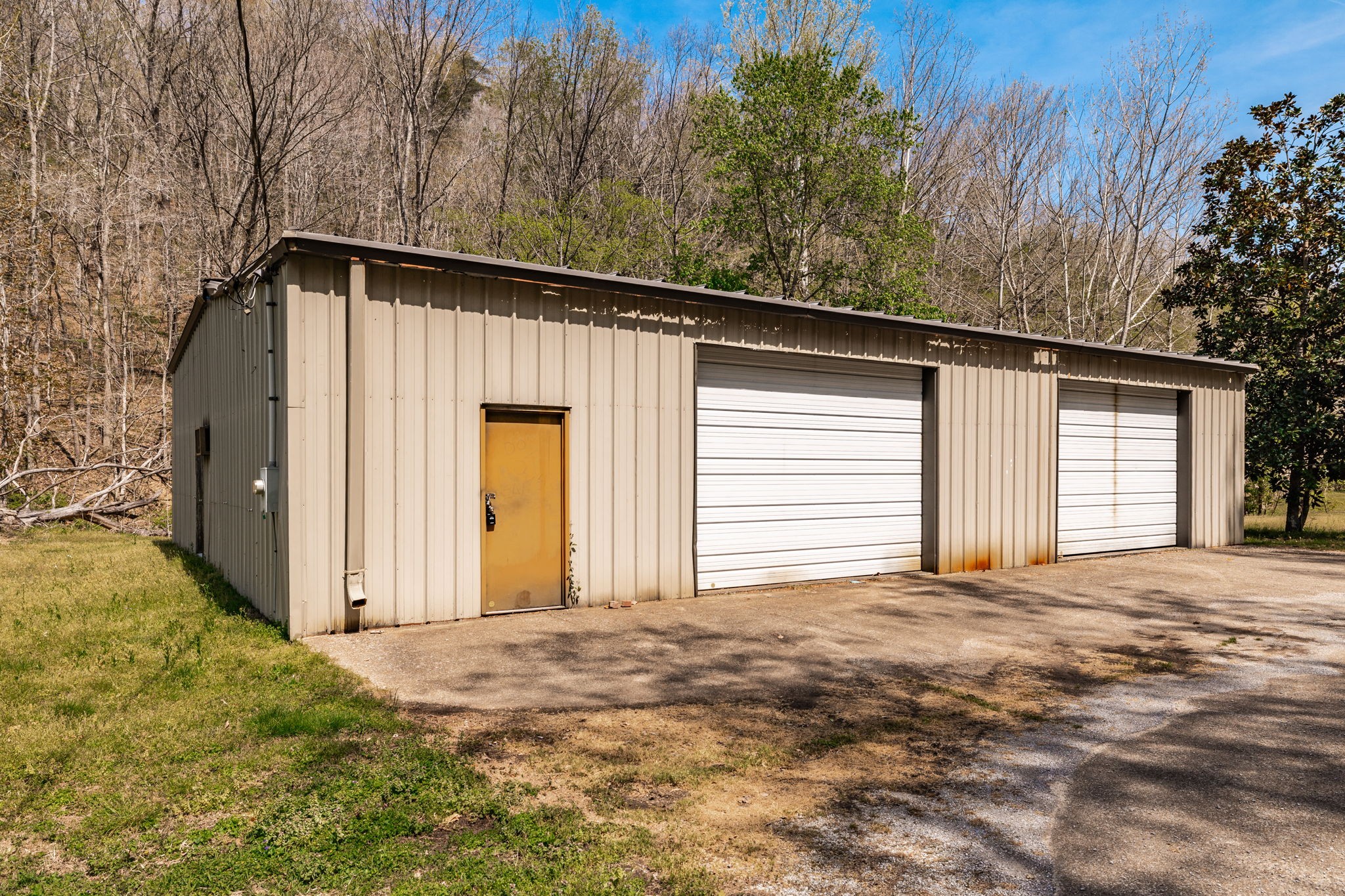 0 Mound Creek Road Kingston Springs, TN 37082 - Photo 68 of 97 a front view of a house with a yard and garage