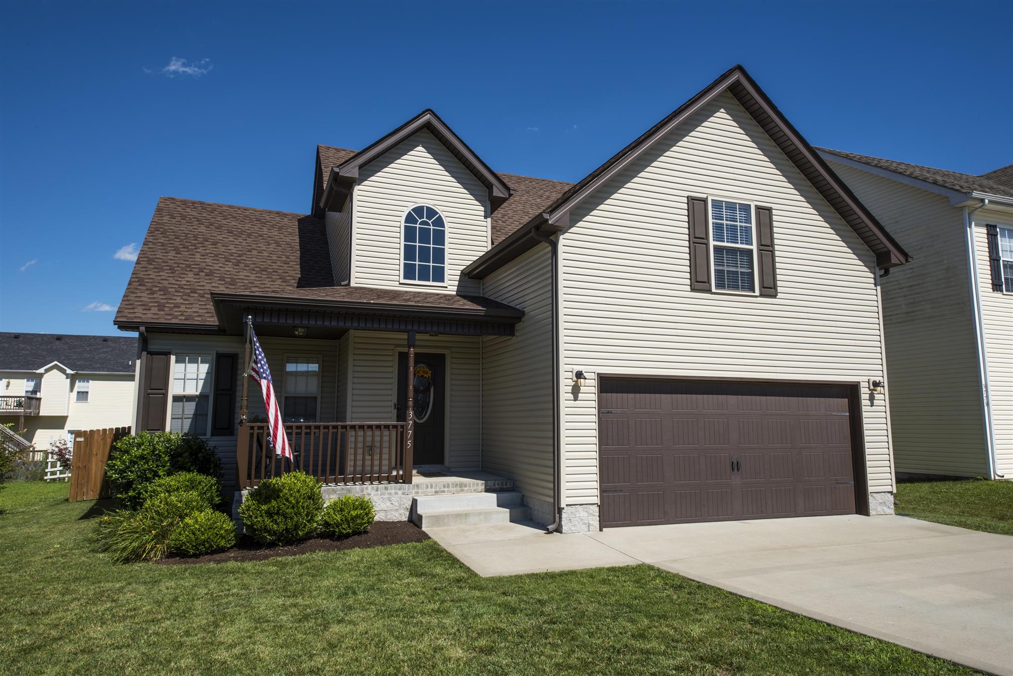 3775 Suiter Road Clarksville, TN 37040 - Photo 2 of 29 a front view of a house with a yard and garage