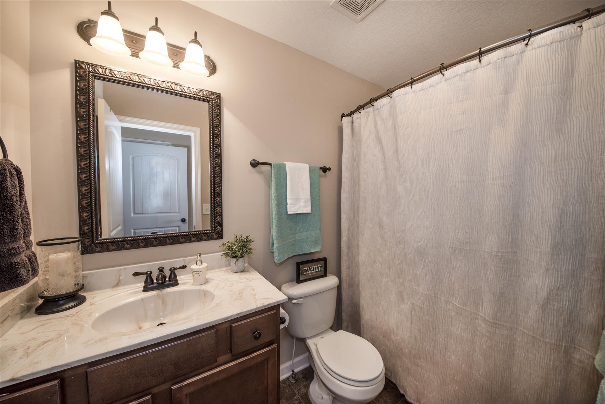 3775 Suiter Road Clarksville, TN 37040 - Photo 21 of 29 a bathroom with a sink a toilet and shower